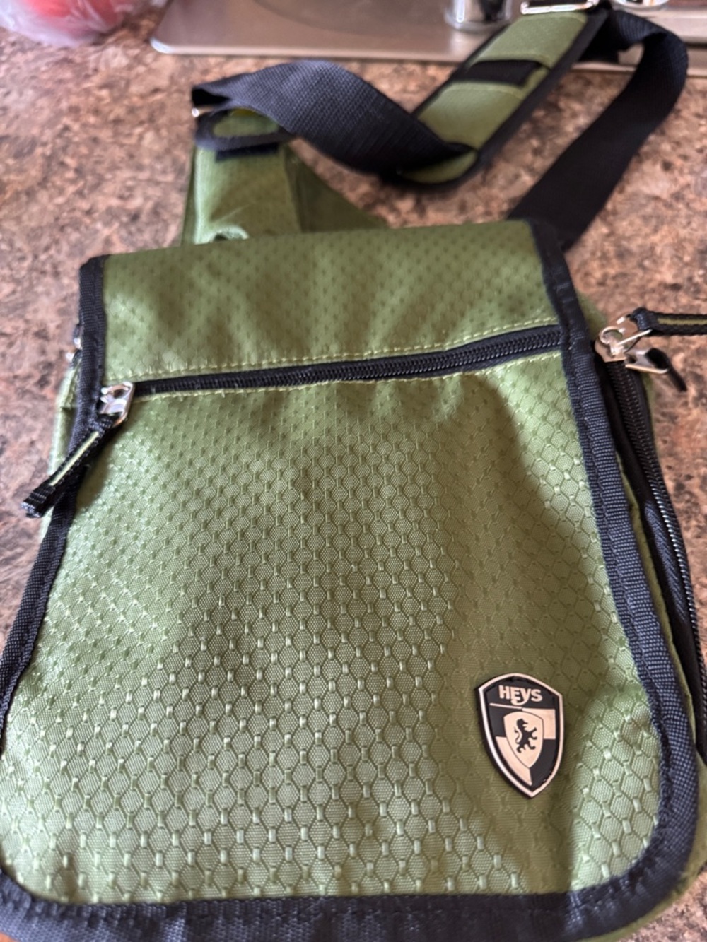 HEYS Olive Green Men's Sling Bag with Front Zip Pocket